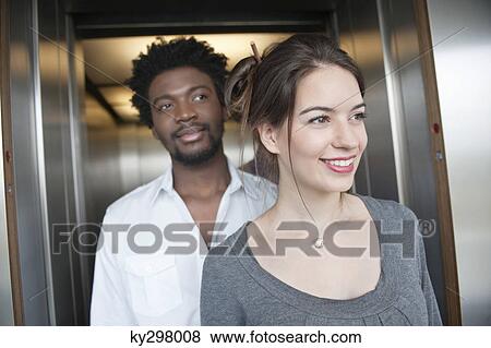 Business executives coming out from an elevator View Large Photo Image Stock Photo - Business executives coming out from an elevator. Fotosearch