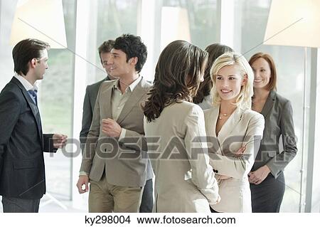 Business executives discussing each other View Large Photo Image Picture - Business executives discussing each other. Fotosearch