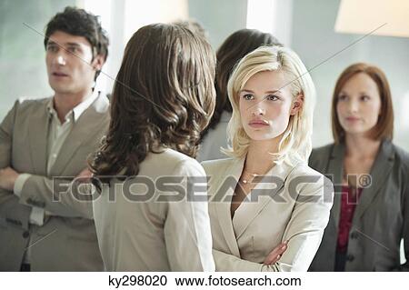 Business executives discussing each other View Large Photo Image Stock Image - Business executives discussing each other. Fotosearch