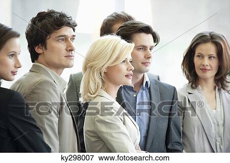Business executives standing together View Large Photo Image Stock Photo - Business executives standing together. Fotosearch