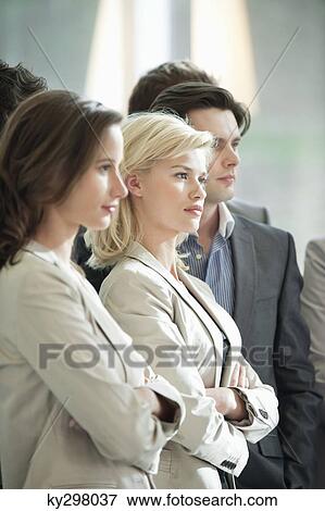 Business executives standing together View Large Photo Image Stock Photo - Business executives standing together. Fotosearch