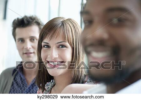 Businesswoman smiling with her colleagues View Large Photo Image Stock Photo - Businesswoman smiling with her colleagues. Fotosearch
