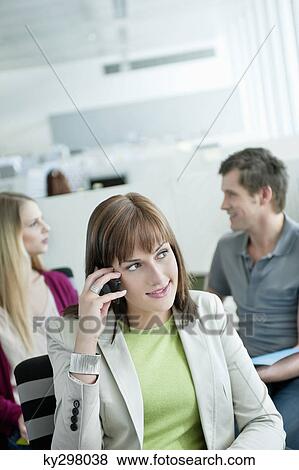 Stock Photo - Close-up of a businesswoman talking on a mobile phone. Fotosearch