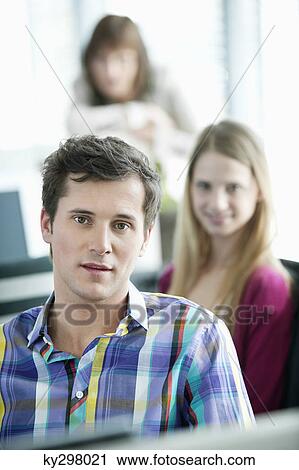 Portrait of a businessman smiling View Large Photo Image Stock Image - Portrait of a businessman smiling. Fotosearch