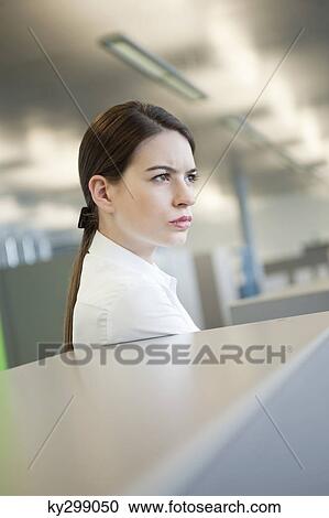 Stock Image - Businesswoman looking serious. Fotosearch