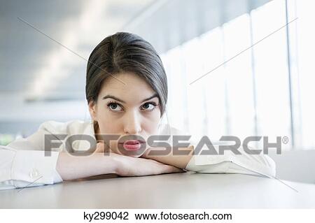 Close-up of a businesswoman looking sad View Large Photo Image Stock Image - Close-up of a businesswoman looking sad. Fotosearch