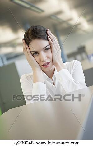 Stock Photo - Close-up of a businesswoman looking worried. Fotosearch