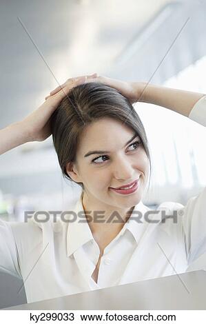 Close-up of a businesswoman smiling View Large Photo Image Stock Image - Close-up of a businesswoman smiling. Fotosearch