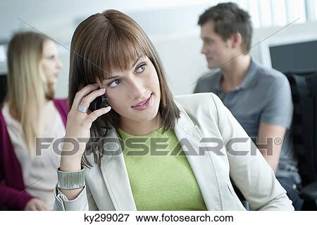 Close-up of a businesswoman talking on a mobile phone View Large Photo Image Stock Photo - Close-up of a businesswoman talking on a mobile phone. Fotosearch