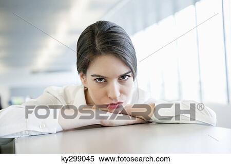 Stock Photography - Portrait of a businesswoman looking sad. Fotosearch