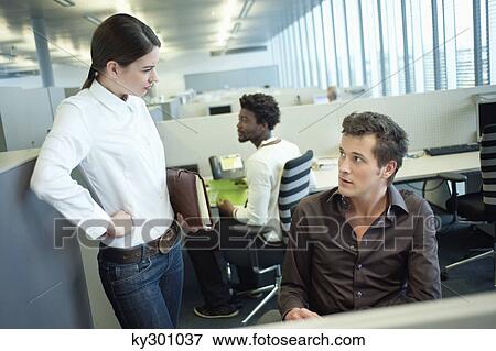 Business executives discussing in an office View Large Photo Image Stock Photo - Business executives discussing in an office. Fotosearch