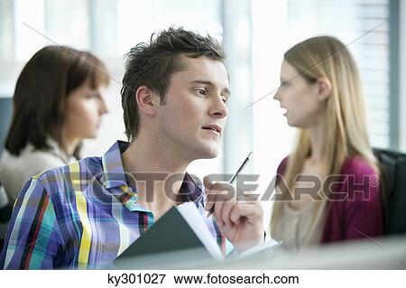 Business executives working in an office View Large Photo Image Stock Photo - Business executives working in an office. Fotosearch