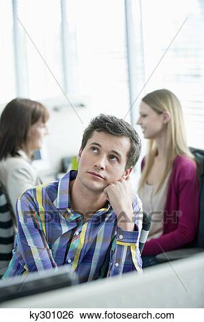 Businessmen day dreaming in an office View Large Photo Image Stock Photograph - Businessmen day dreaming in an office. Fotosearch