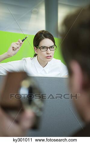 Businesswomen looking angry in an office View Large Photo Image Stock Image - Businesswomen looking angry in an office. Fotosearch