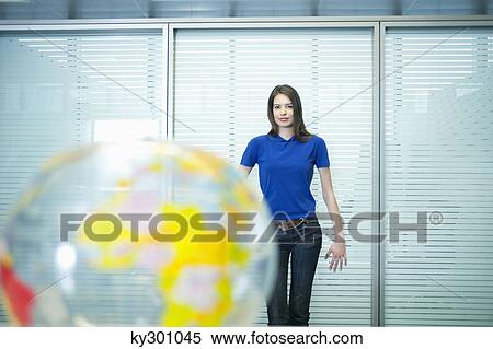 Portrait of a businesswoman standing in an office View Large Photo Image Stock Photography - Portrait of a businesswoman standing in an office. Fotosearch