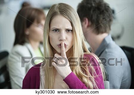 Portrait of a businesswoman with her finger on her lips View Large Photo Image Stock Image - Portrait of a businesswoman with her finger on her lips. Fotosearch