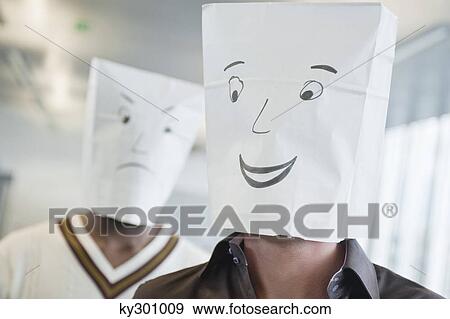 Two businessmen wearing paper bags of happy and sad faces View Large Photo Image Stock Photo - Two businessmen wearing paper bags of happy and sad faces. Fotosearch