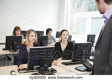 Business executives in a training class View Large Photo Image Stock Image - Business executives in a training class. Fotosearch