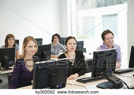 Business executives smiling in a training class View Large Photo Image Stock Image - Business executives smiling in a training class. Fotosearch