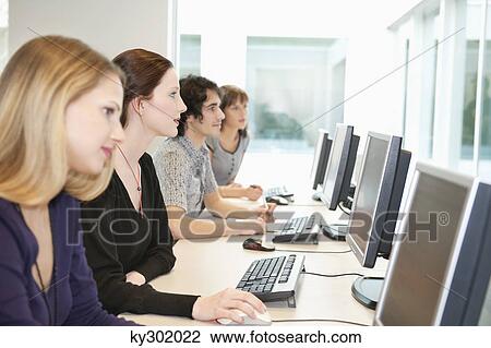 Business executives working on computers in a training class View Large Photo Image Stock Image - Business executives working on computers in a training class. Fotosearch