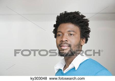 Close-up of a man day dreaming View Large Photo Image Stock Photo - Close-up of a man day dreaming. Fotosearch