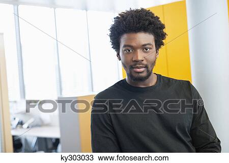 Portrait of a businessman in an office View Large Photo Image Stock Image - Portrait of a businessman in an office. Fotosearch