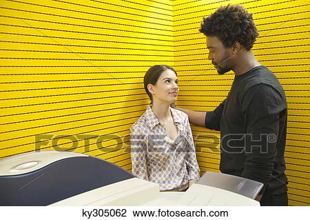 Business executives standing near photocopy machine and smiling View Large Photo Image Stock Image - Business executives standing near photocopy machine and smiling. Fotosearch