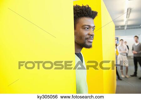 Businessman day dreaming in an office View Large Photo Image Stock Photograph - Businessman day dreaming in an office. Fotosearch
