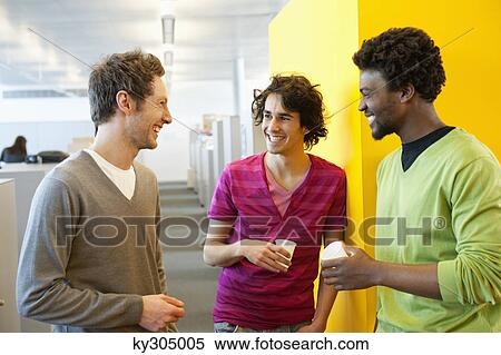 Businessmen drinking tea in an office View Large Photo Image Stock Photography - Businessmen drinking tea in an office. Fotosearch