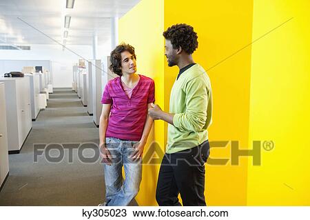 Businessmen standing in an office View Large Photo Image Stock Image - Businessmen standing in an office. Fotosearch