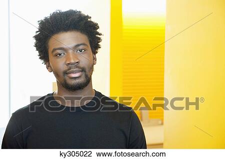 Portrait of a businessman in an office View Large Photo Image Stock Image - Portrait of a businessman in an office. Fotosearch