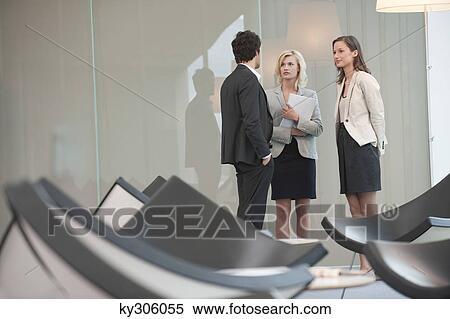 Business executives discussing in an office View Large Photo Image Stock Photography - Business executives discussing in an office. Fotosearch