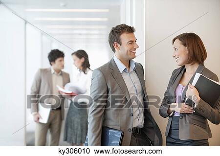 Stock Image - Business executives in an office. Fotosearch