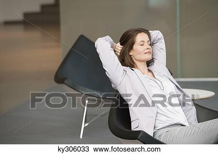 Businesswoman waiting in an office looking tired View Large Photo Image Stock Image - Businesswoman waiting in an office looking tired. Fotosearch