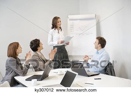Business executives applauding their colleague presenting board room meeting View Large Photo Image Stock Image - Business executives applauding their colleague presenting board room meeting. Fotosearch