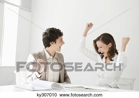 Stock Image - Business executives celebrating their success. Fotosearch