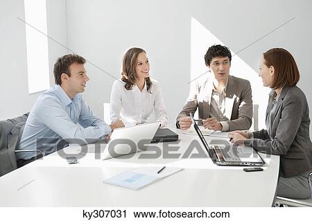 Business executives discussing in a meeting View Large Photo Image Stock Image - Business executives discussing in a meeting. Fotosearch