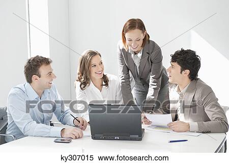Business executives discussing in a meeting View Large Photo Image Stock Photography - Business executives discussing in a meeting. Fotosearch