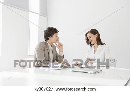 Business executives in a conference room View Large Photo Image Stock Photo - Business executives in a conference room. Fotosearch