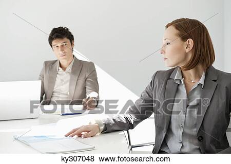 Business executives in a conference room View Large Photo Image Stock Photo - Business executives in a conference room. Fotosearch