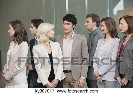 Business executives standing together View Large Photo Image Stock Photo - Business executives standing together. Fotosearch