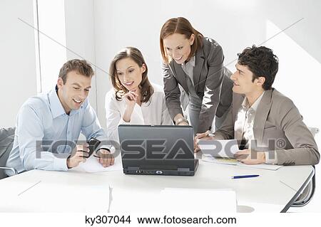 Business executives working in an office View Large Photo Image Picture - Business executives working in an office. Fotosearch