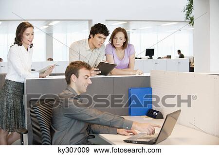 Business executives working in an office View Large Photo Image Stock Photo - Business executives working in an office. Fotosearch