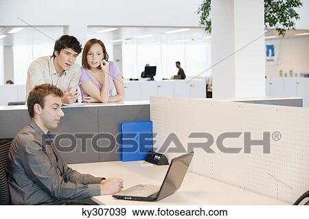 Business executives working in an office View Large Photo Image Stock Photo - Business executives working in an office. Fotosearch