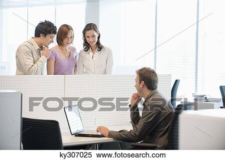 Stock Photography - Business executives working in an office. Fotosearch