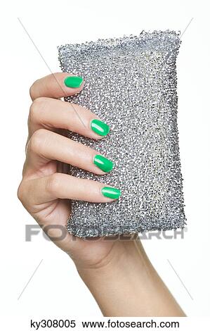 Stock Photography - Close-up of woman's hand holding purse. Fotosearch