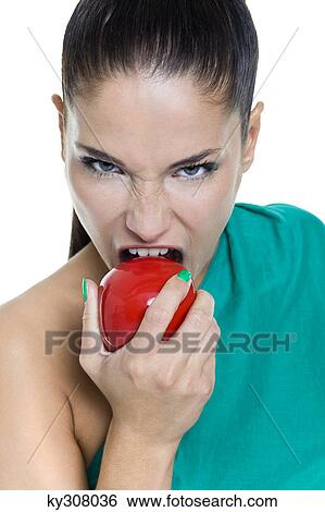 Stock Photograph - Young woman biting an apple. Fotosearch