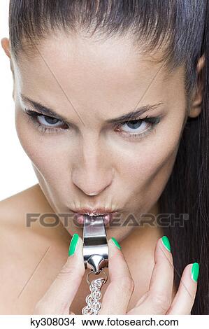 Young woman blowing whistle View Large Photo Image Picture - Young woman blowing whistle. Fotosearch