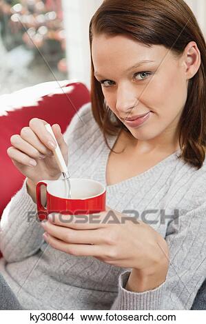 Picture - Young woman drinking coffee. Fotosearch