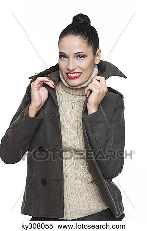Young woman holding jacket collar View Large Photo Image Stock Photography - Young woman holding jacket collar. Fotosearch